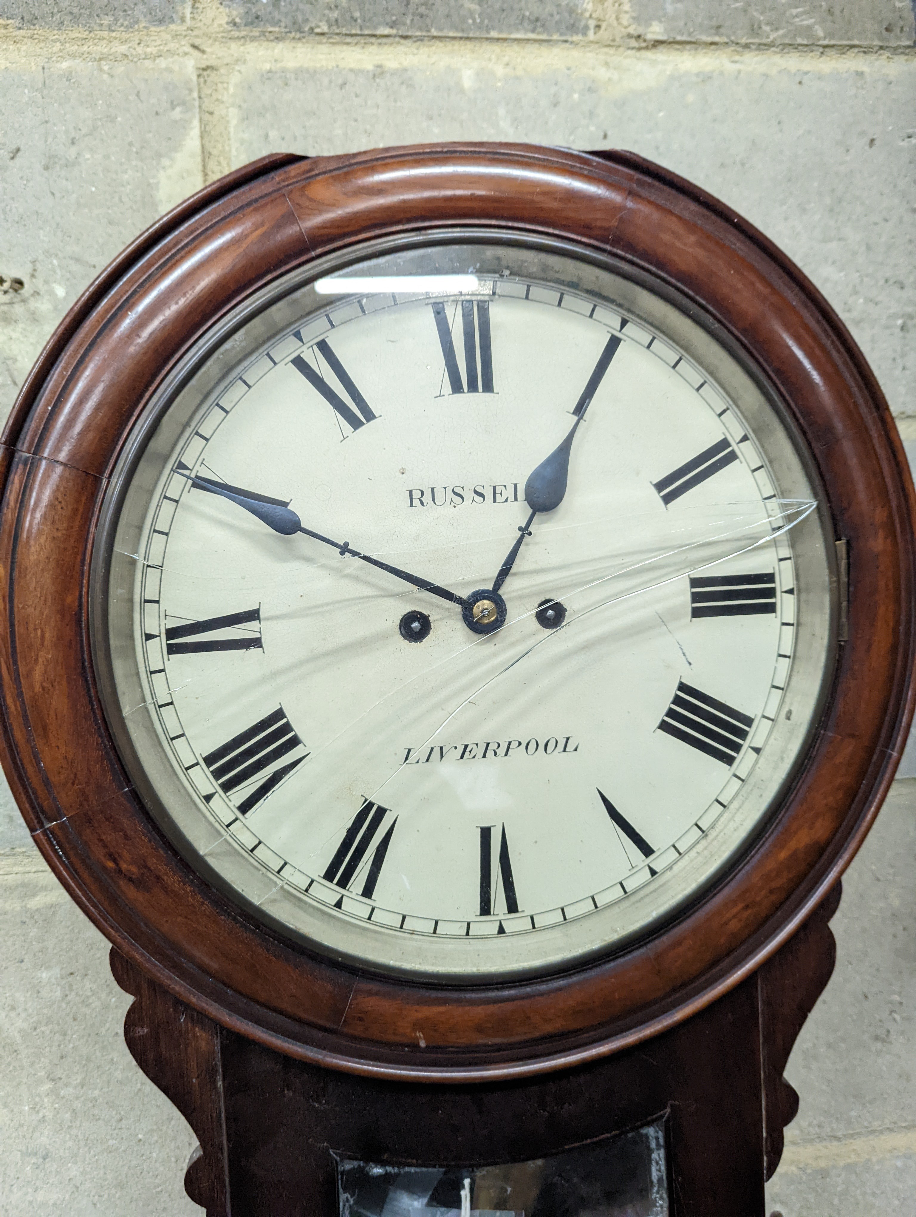 A Victorian mahogany drop dial wall clock, with twin fusee movement, and circular white painted Roman dial signed 
